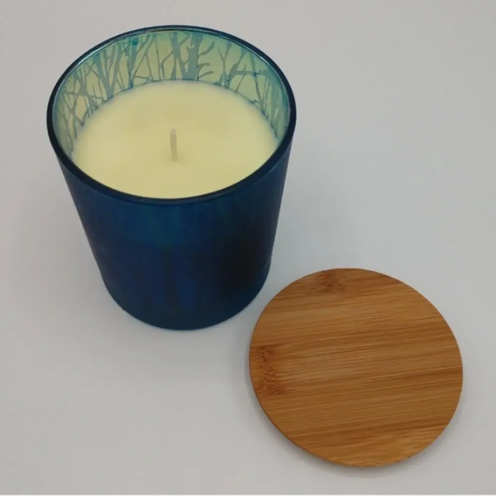 Elegant Blue Glass Candle with Tree Silhouettes